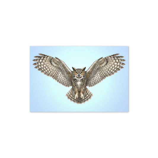 Product mockup flat-lay of Great Horned Owl Greeting Card, with a realistic flying owl against a clear blue sky.