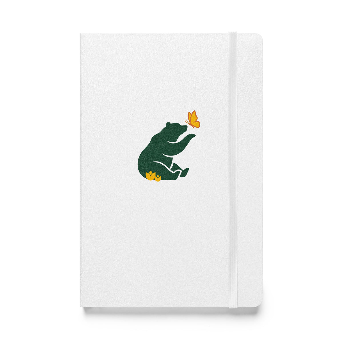 Flat-lay of white notebook with green Petals & Paws bear graphic, sitting in yellow flowers with paw extended to yellow and orange butterfly.