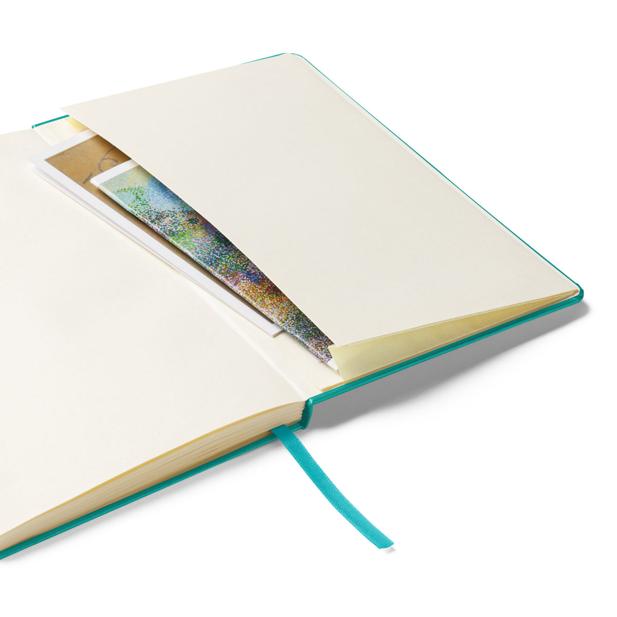 Turquoise Beary Petals & Paws Hardcover Notebook laying open to reveal the expandable pocket on the inside of the back cover.