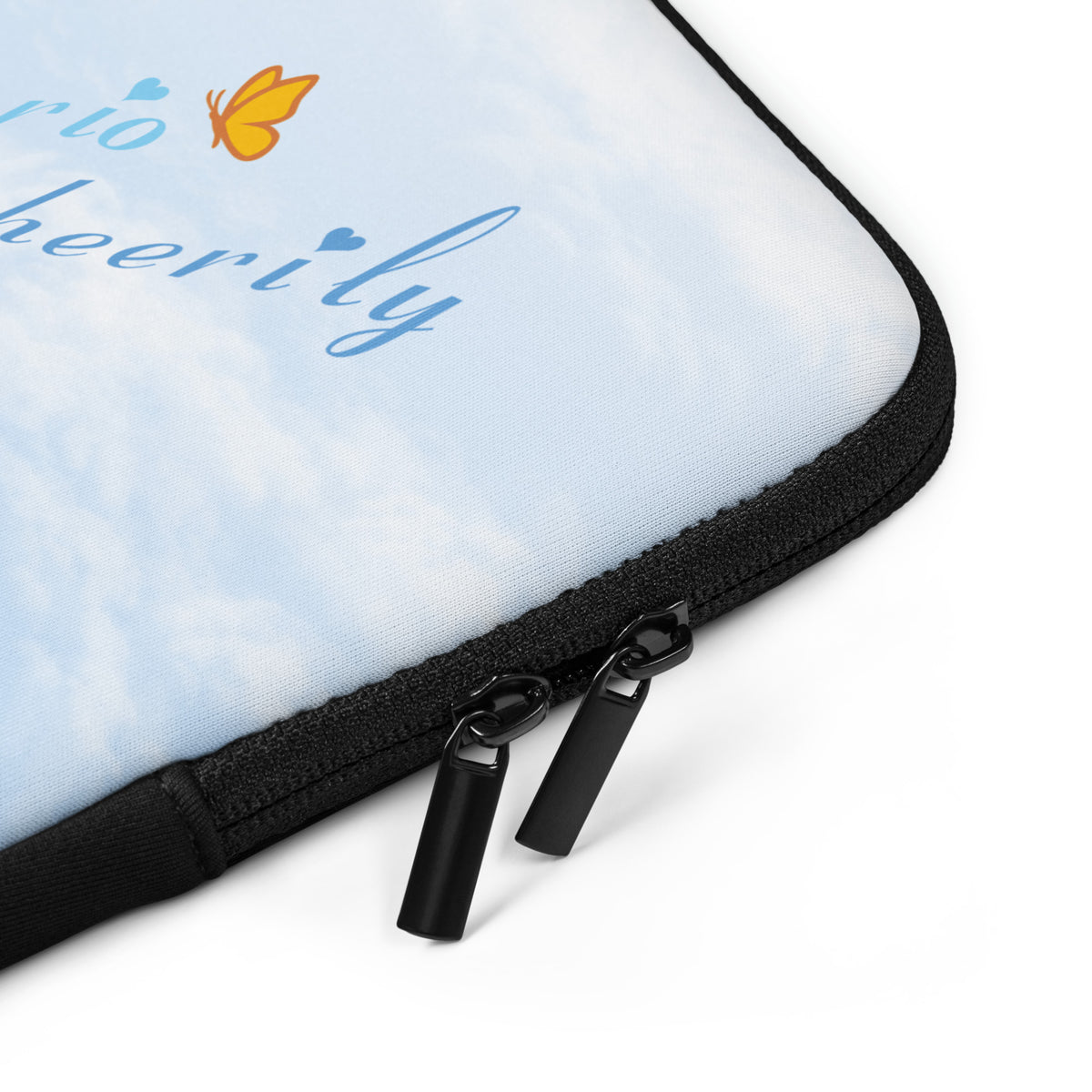 Close-up product mockup of the Cheerily Robin Laptop Sleeve's black binding and zipper.  The all-over fair blue sky and fluffy cloud background, along with a portion of the songster's text and Petals & Paws butterfly are also revealed.