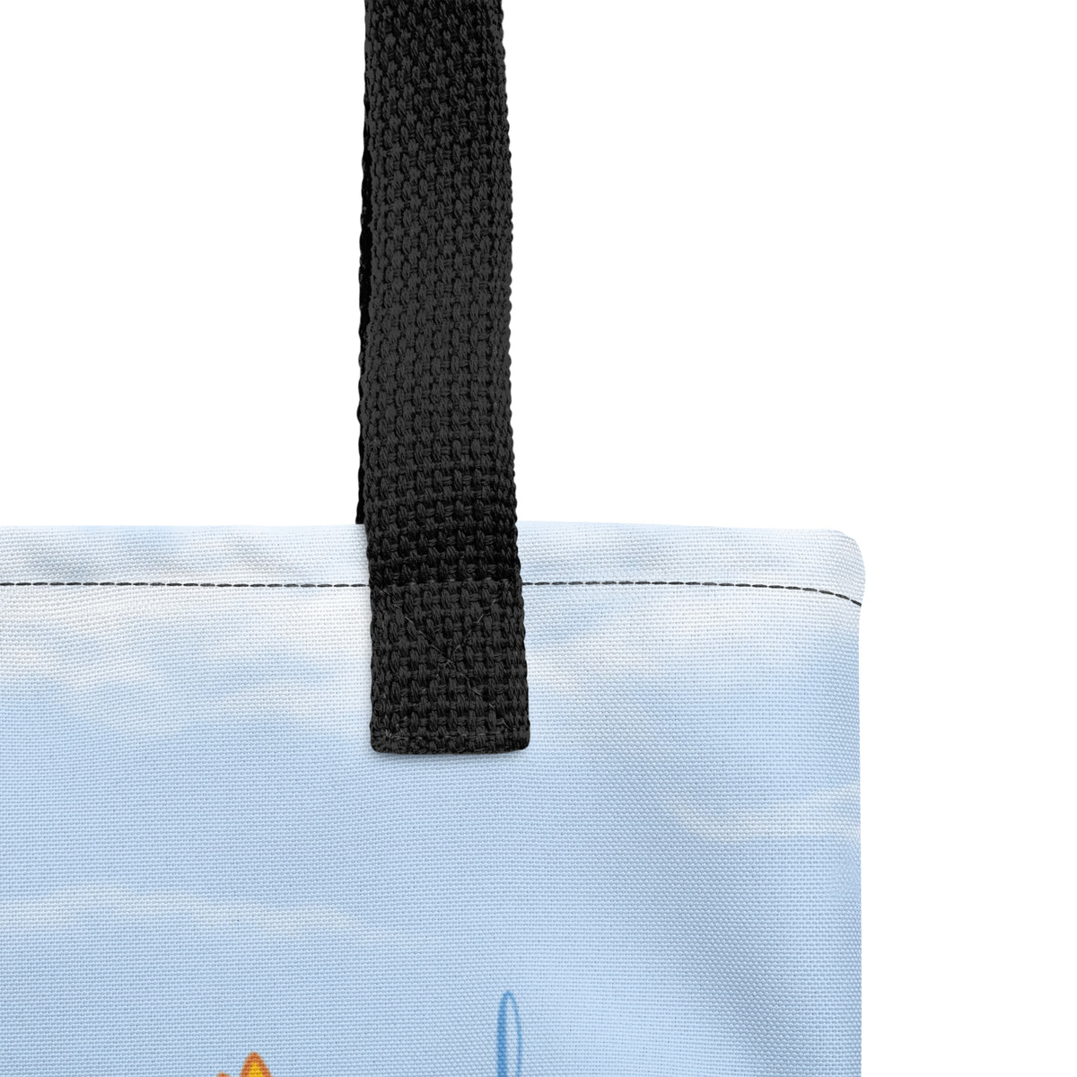 Product mockup close-up of Cheerily Robin Tote black dual handles and how they are attached to the bag.  Handles are made from 100% natural cotton bull denim, with length at 26″ (67 cm), width 1″ (2.5 cm).