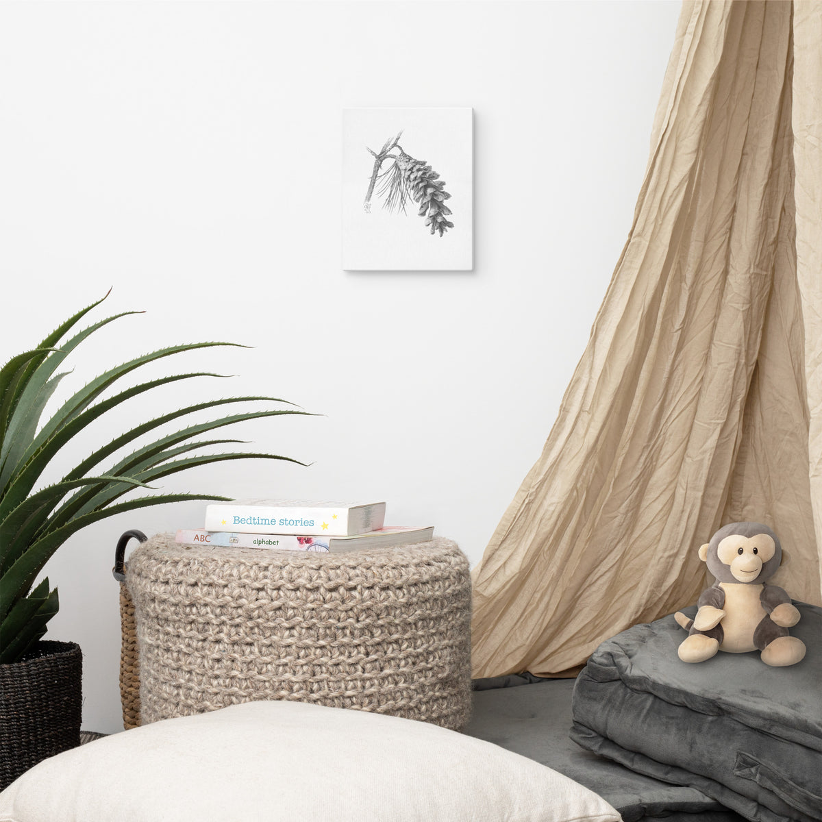 Gallery-wrapped canvas of Pinus strobus - Eastern White Pine, graphite depiction of an Eastern white pinecone on a winter-bare branch, hanging on a wall with surrounding home furnishings.  Illustrated by Suzanne Matheson, 2017.