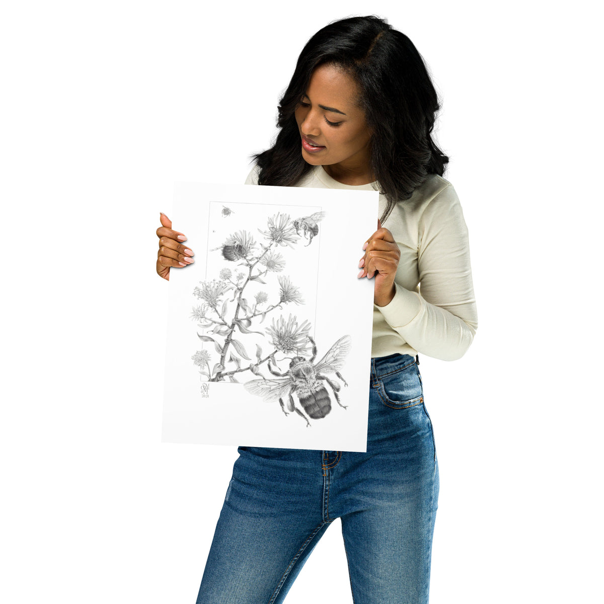 Person holding 11x14 inch museum-quality print of Late Autumn Forage illustration of bumblebees and asters to show relative size. Graphite illustration by Suzanne Matheson, 2017.