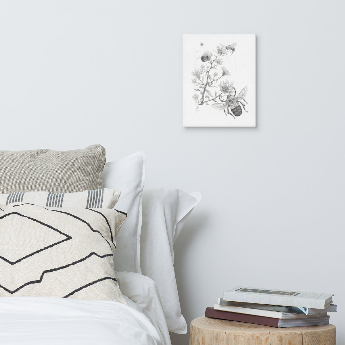 Gallery-wrapped canvas of Late Autumn Forage, about bumblebees foraging and pollinating asters, hanging on a wall with surrounding home furnishings.  Graphite illustration by Suzanne Matheson, 2017.