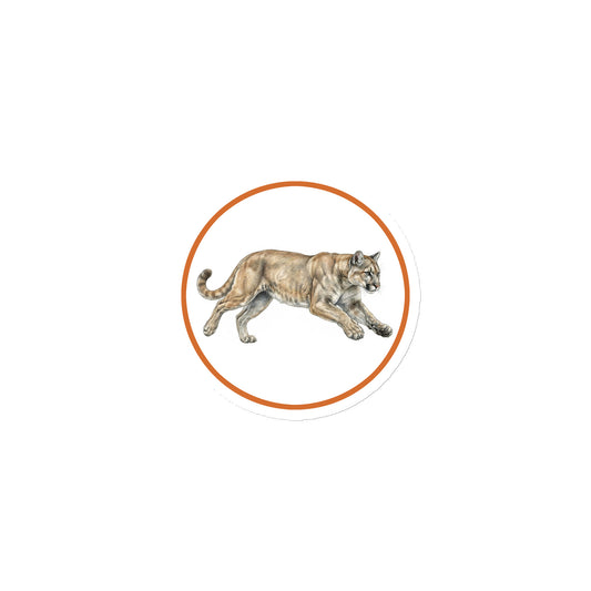 Product mockup of Mountain Lion Circular Magnet, a 3" die-cut magnet featuring a realistic cougar within a orange circle.