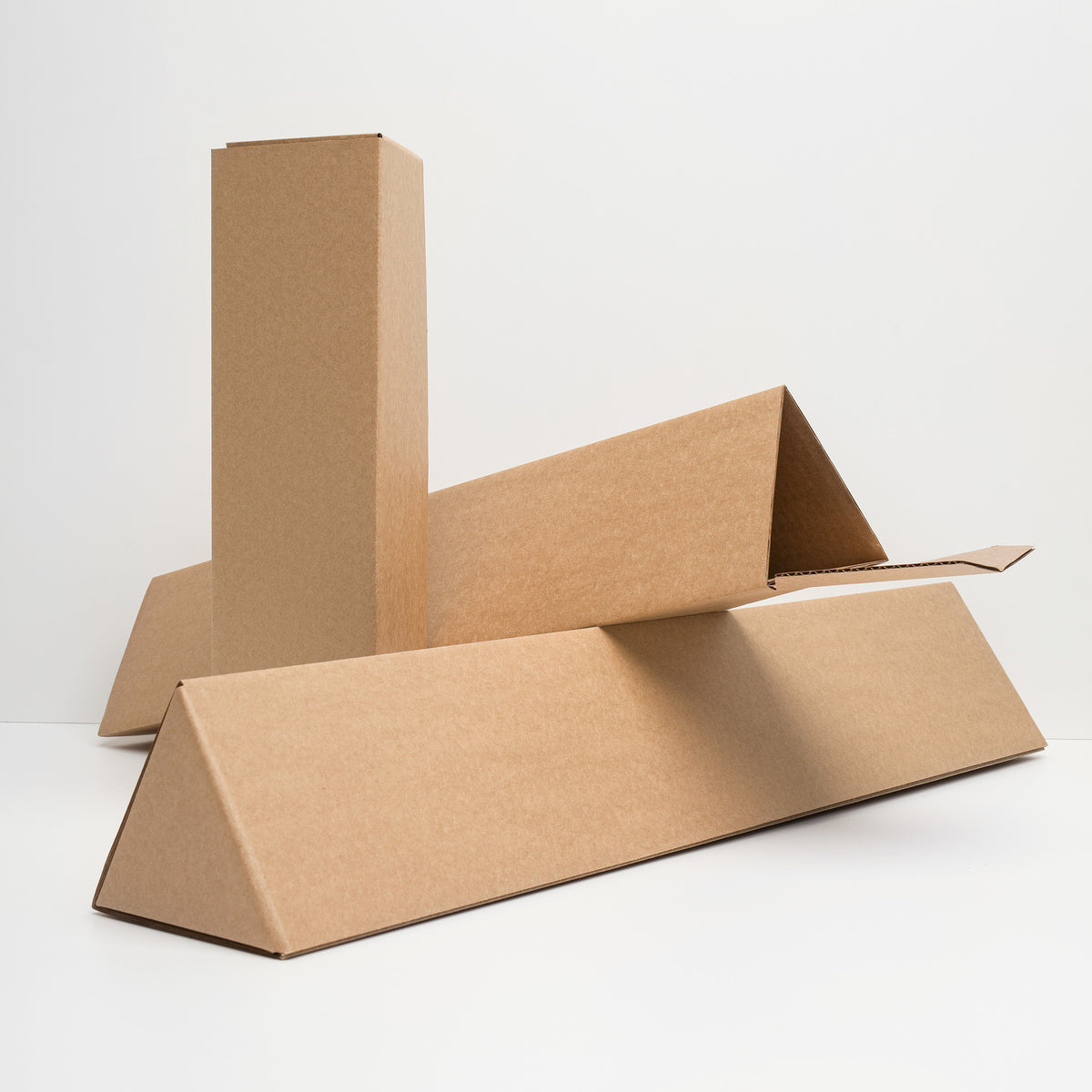 Protective cardboard packaging for museum-quality prints, illustrated by Suzanne Matheson.