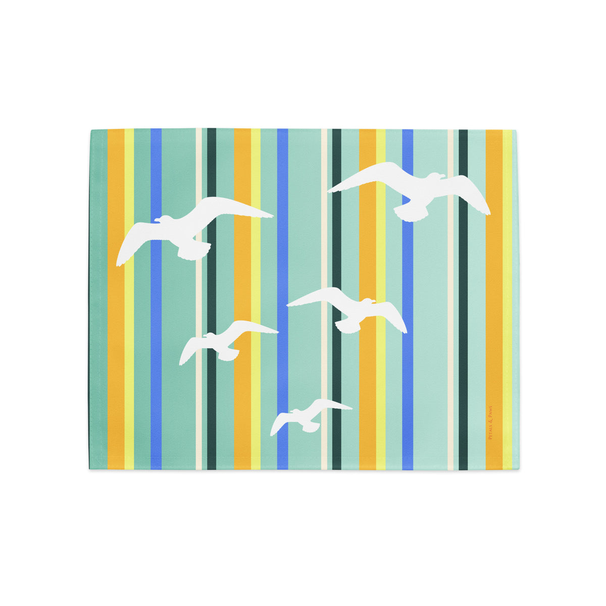 Product mockup of a Petals & Paws Cove Placemat, featuring seagull design with teal striped pattern.
