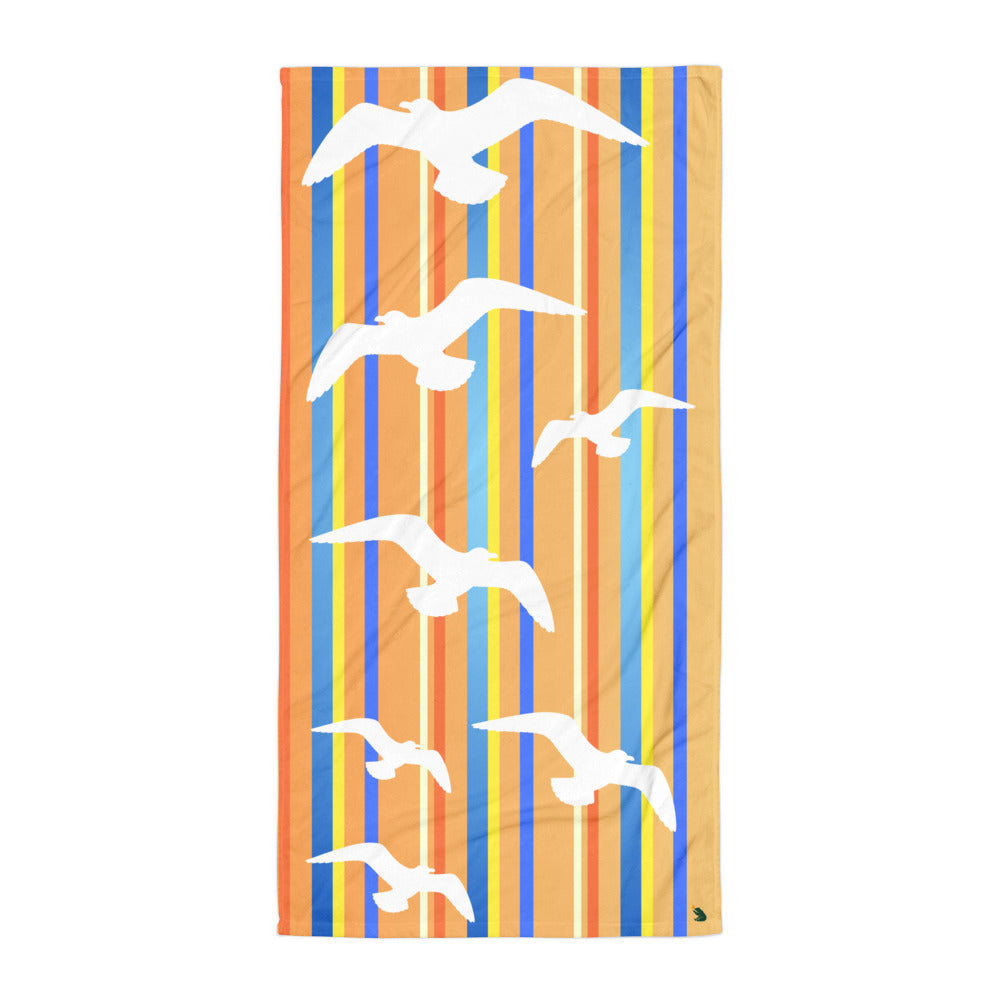 A flat-lay of 30 x 60" Petals & Paws Drift Beach Towel. This terry fabric towel features seagull design with orange striped pattern.