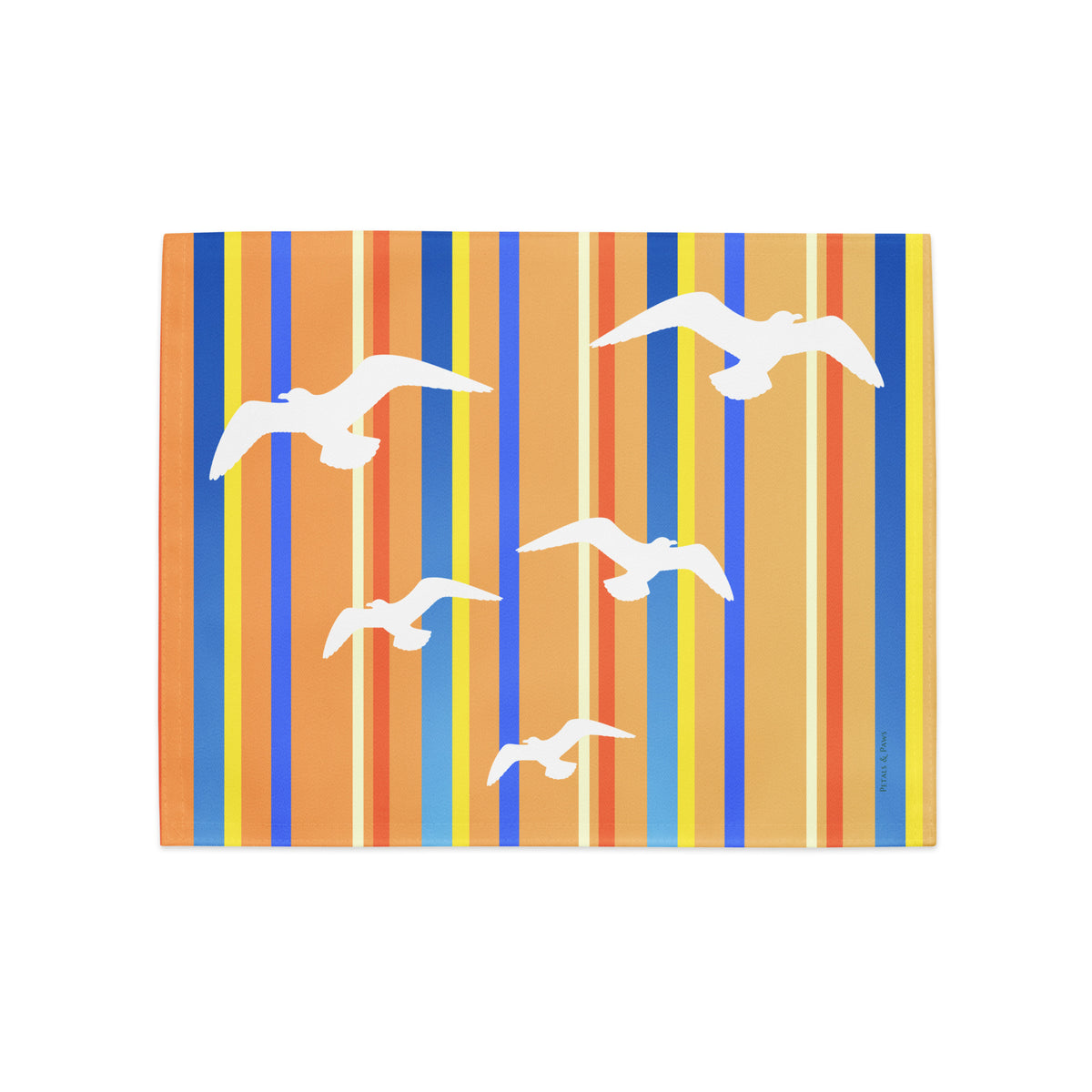 Product mockup of a Petals & Paws Drift Placemat, featuring seagull design with orange striped pattern.