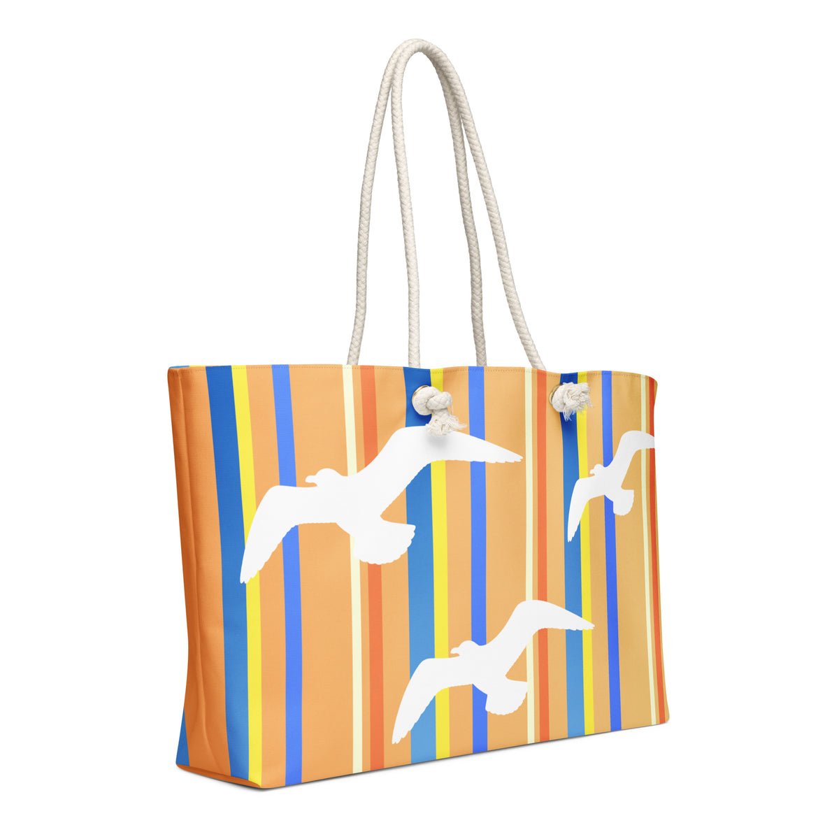 A diagonal view of Petals & Paws Drift Weekender Bag showing the pattern as it wraps around the ends of the bag. This all-over print bag features seagull design with orange striped pattern and cream-colored cotton rope handles.