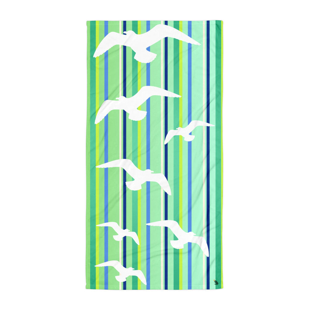 A flat-lay of 30 x 60" Petals & Paws Harbour Beach Towel. This terry fabric towel features seagull design with green striped pattern.