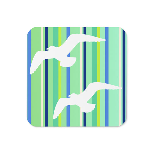 Product mockup of the front of Petals & Paws Harbour Coaster cork-backed, square coaster.  Design is seagulls are flying against a green striped pattern.