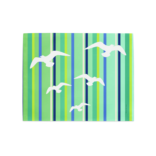Product mockup of a Petals & Paws Harbour Placemat, featuring seagull design with green striped pattern.