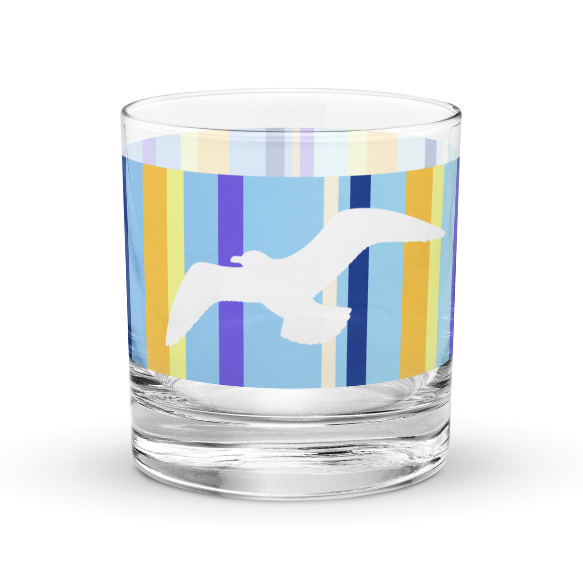 Product mockup of 10.5 oz Petals & Paws Shoreline Rocks Glass, featuring seagull design with blue striped pattern.