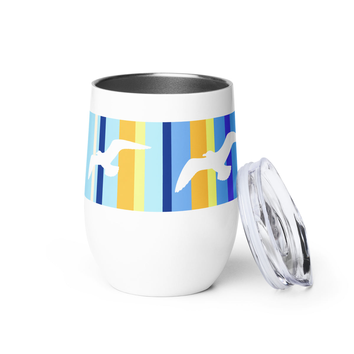 A Petals & Paws Shoreline Wine Tumbler standing on a white surface with the tumbler sip-lid propped up against it. This tumbler features a seagull design with blue striped pattern.