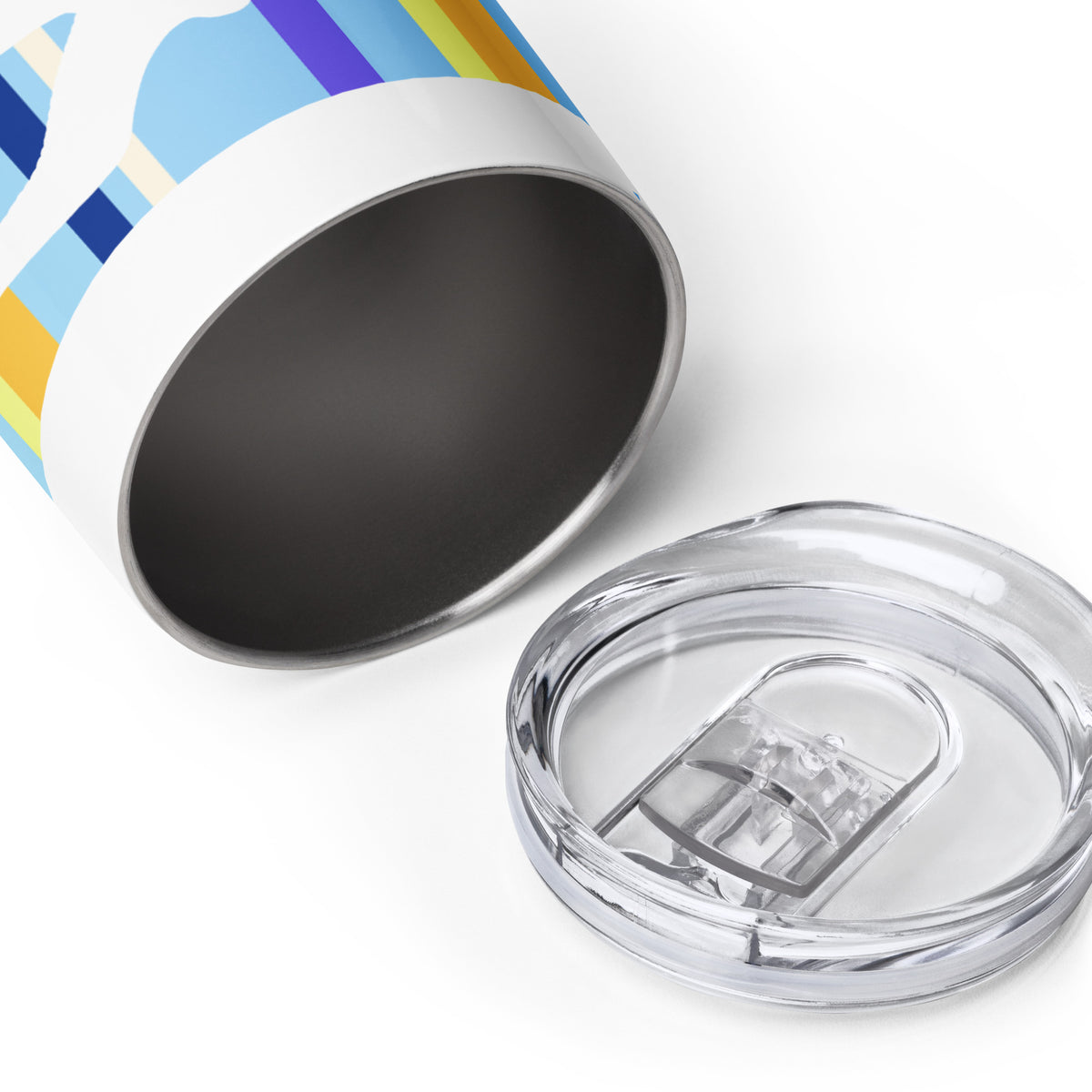 A Petals & Paws Shoreline Wine Tumbler laying on a white surface, on its side, to reveal the stainless steel interior. The tumbler sip-lid is sitting in front of the tumbler.
