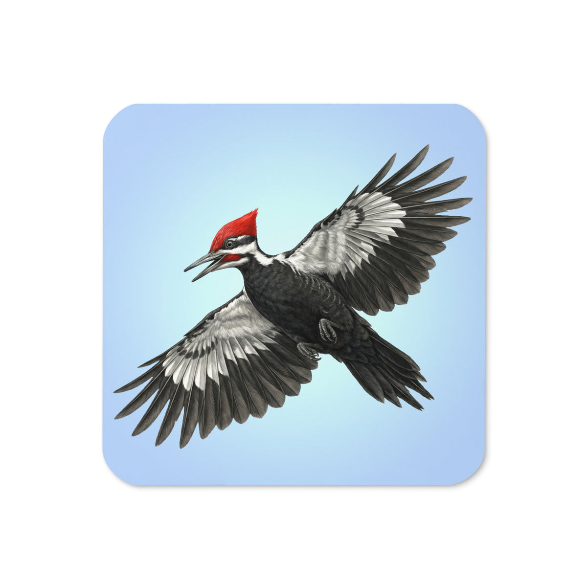 Product mockup of the front of Pileated Woodpecker Coaster cork-backed, square coaster.  Design is a woodpecker is flying against a clear blue sky.