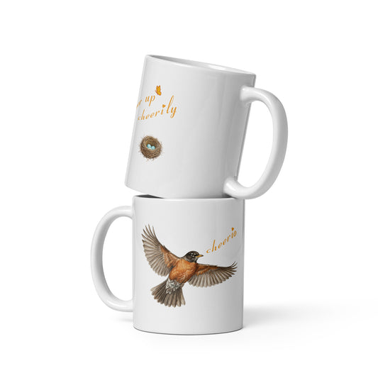 Product mockup, two 11 oz stacked Robin Discovery Ceramic Mugs, the bottom one reveals the front flying robin design and the top reveals the back nest of robin-blue design. 