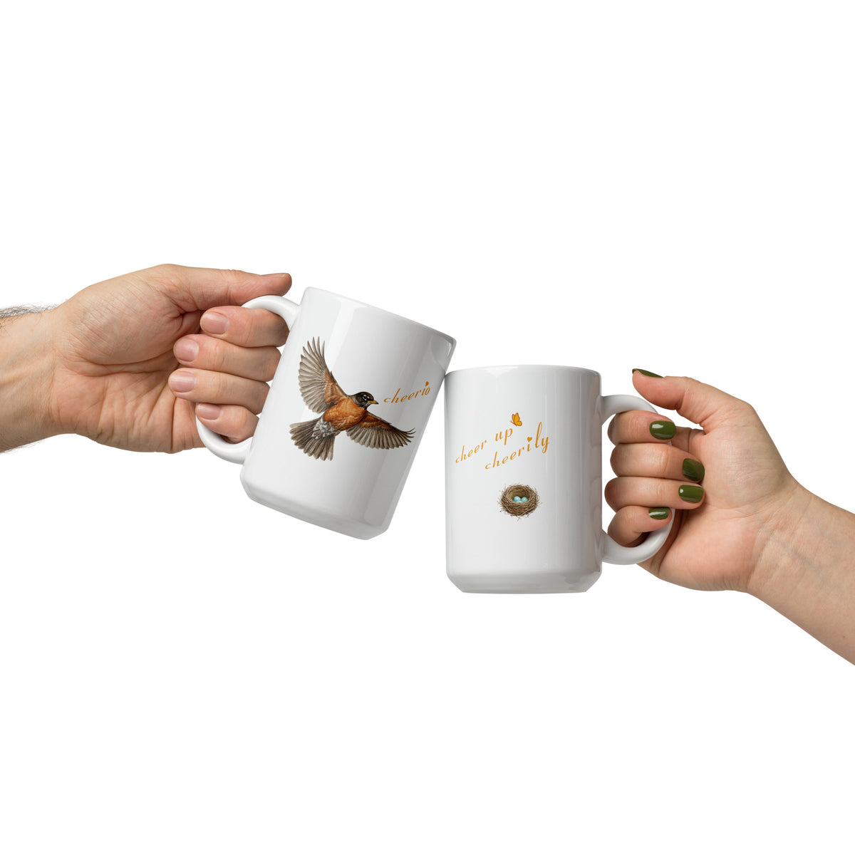 Product mockup, two 15 oz Robin Discovery Ceramic Mugs held in hands, clinked together, one reveals the front flying robin design and the other reveals the back nest of robin-blue design. 