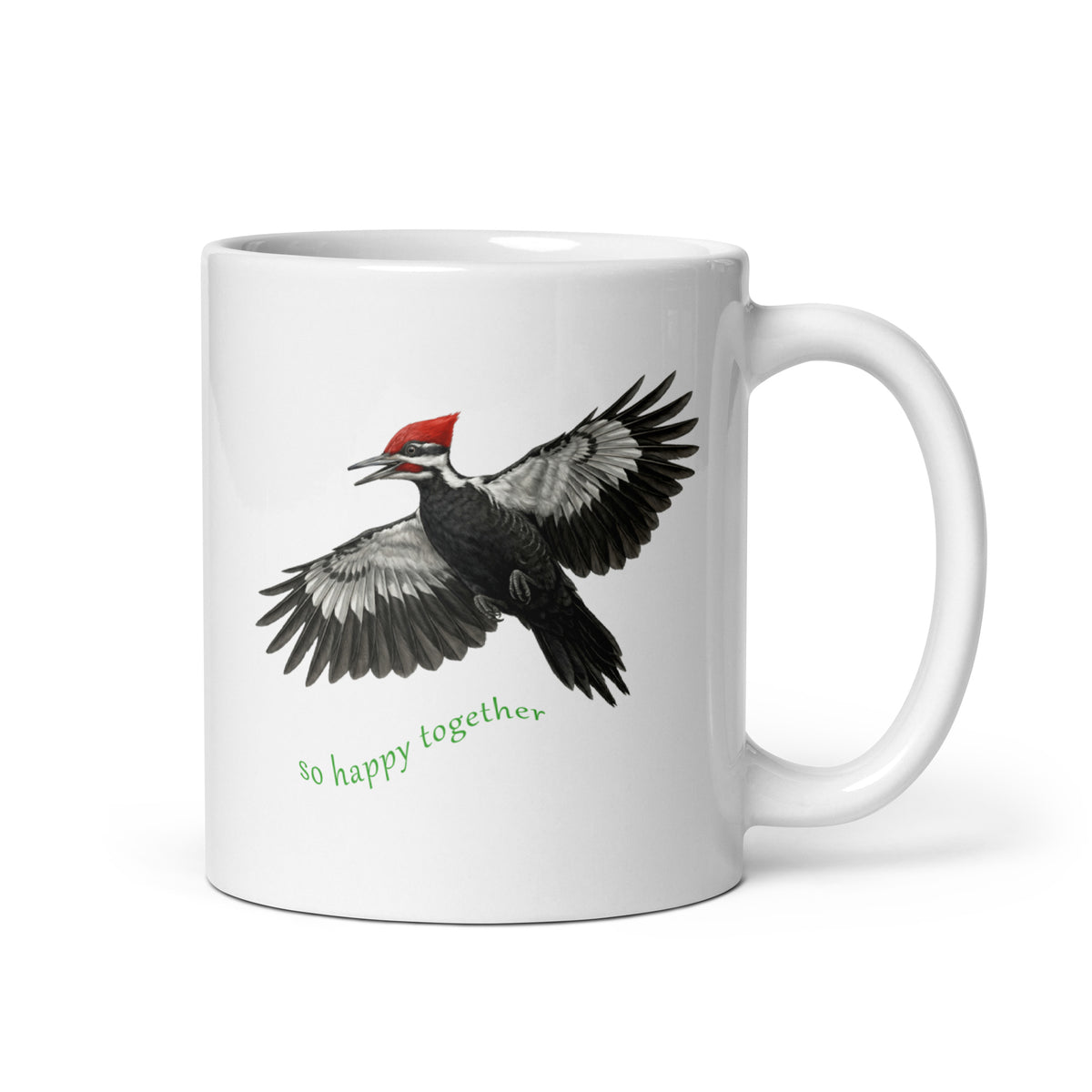 White mug with a flying realistic Pileated Woodpecker design and 'so happy together' text on a white background.